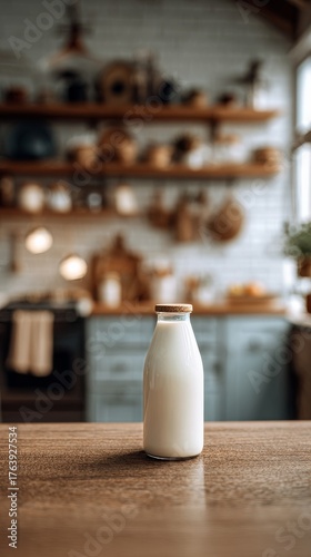 Fresh Milk in a Glass Bottle Beside Baked Goods on a Wooden Table in a Cozy K...