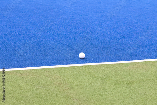Hockey ball on an artificial grass field