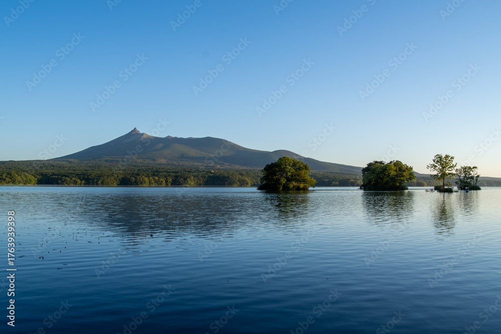 Fototapeta premium Mt. Komagatake reflected in Lake Onuma on a quiet morning