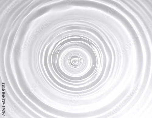 Abstract close-up of concentric water ripples radiating outwards from a central point, creating a mesmerizing circular pattern.