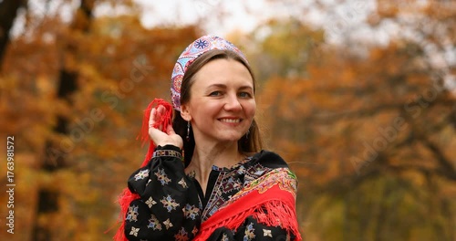 Young beautiful woman in a headscarf in an autumn park