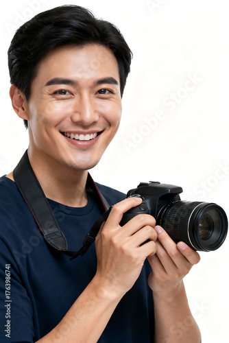 Smiling photographer holding camera