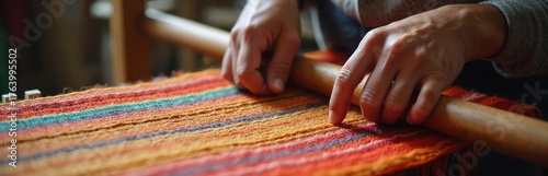 Artisan hands skillfully weave colorful textile threads on loom, creating vibrant patterns. Close-up traditional craftsmanship, detailed fabric design, production of hand-made materials with