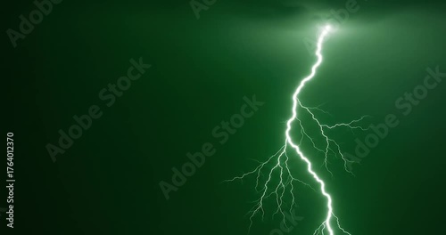 bright green lightning bolt strikes down from a dark stormy sky.