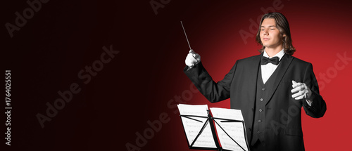 Male conductor with note sh...