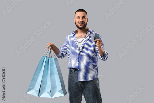 Stylish young man with shop...