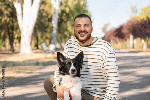 Young man with Border Colli...