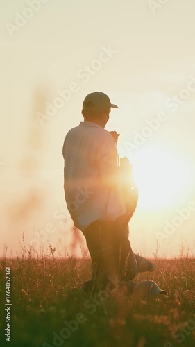 Parent, daughter having fun outdoors. Dad playing with daughter on field summer. Father spinning child holding girl by hands sunset lawn. Family in park. Happy family play in park. Child dream concept
