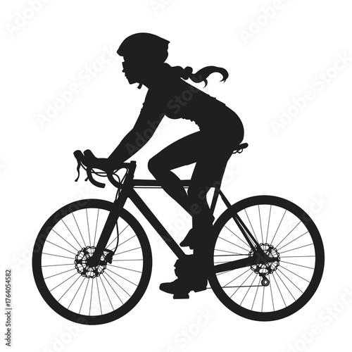 Silhouette of a woman cyclist riding a bicycle