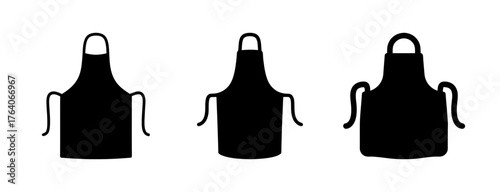 Three black kitchen aprons isolated front view silhouette cooking garments for food preparation and safety