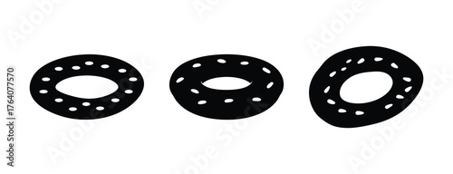Three distinct stylized bagels with numerous small circular perforations arranged around their circumference isolated on a