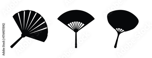 Set of three elegant black bamboo folding fans in diverse open styles a symbol of traditional design