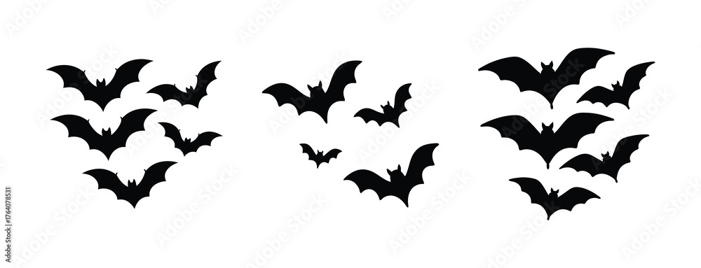 Fototapeta premium Three silhouetted bat swarms flying together in a cluster for halloween or spooky themed designs