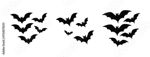 Three silhouetted bat swarms flying together in a cluster for halloween or spooky themed designs