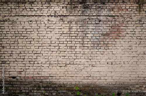 Old Brick Wall With Weathered Texture and Natural Decay