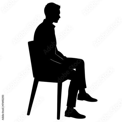 Silhouette of a man sitting on a chair side view of a relaxed person