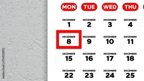 The date December 8th marked with a red cursor on the wall calendar 2025