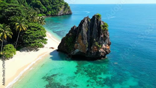 Relaxing Tropical Beach with Crystal Clear Water and Lush Greenery