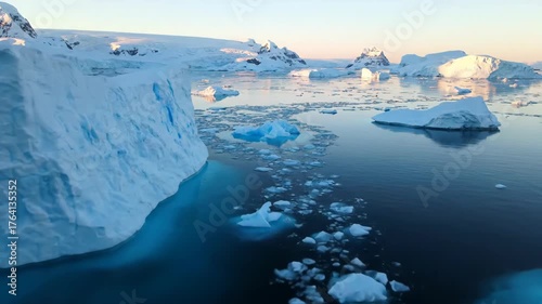 Serene Arctic Landscape with Icebergs and Calm Water Reflections