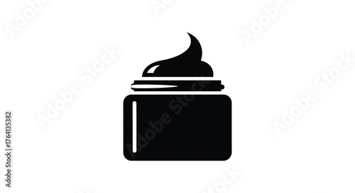 A black silhouette of a jar with a dollop of cream or cosmetic product on top against a white background