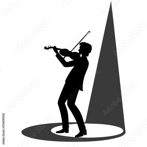 Silhouette of a violinist playing on stage under a spotlight performance