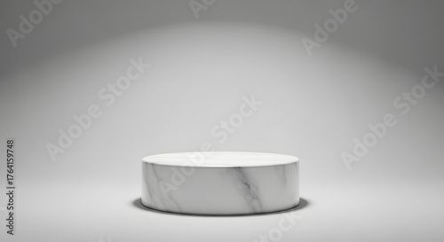 Elegant white marble cylindrical display pedestal, minimalist design, spotlight-illuminated on a clean studio backdrop. Ideal for premium product mockups and sophisticated presentations