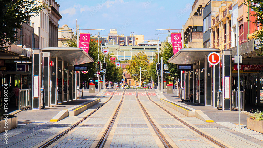 Obraz premium Landscape view of Sydney's light rail line and tram stop on Church Street on a quiet afternoon