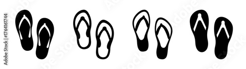 Four pairs of simple black flip-flop sandals isolated on a plain backdrop