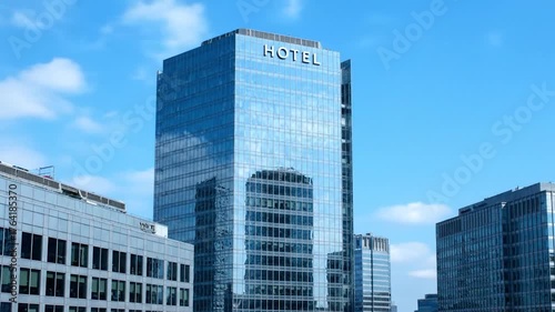 A tall, modern glass skyscraper with 