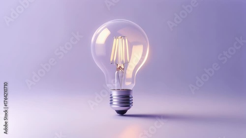 Clear incandescent bulb on a gradient background of mint green and soft purple
