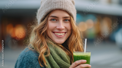 Wallpaper Mural Smiling woman holding a healthy detox smoothie Torontodigital.ca