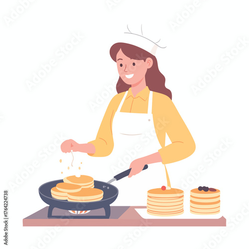 A smiling woman in a chef's hat cooks pancakes in a pan, with stacks of pancakes nearby.