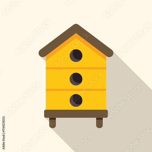 Yellow wooden beehive with round entrances standing on legs, providing a home for bees and facilitating honey production