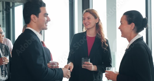 Group of diverse professionals businesspeople enjoying a networking event, listening to a startup business owner. Diverse people socialize at social networking event. Teamwork, Corporate concept