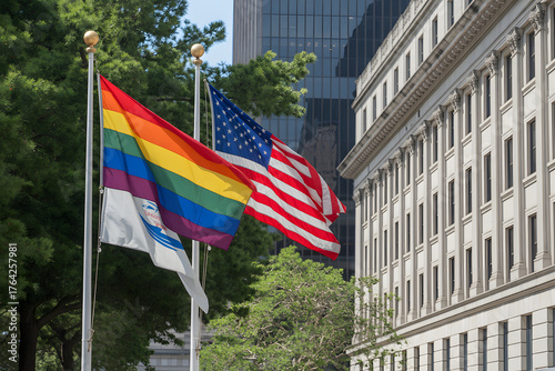 pride and usa flags outside government building in city