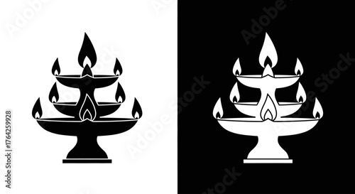 A black and white graphic icon of a traditional multi-tiered Indian oil lamp, or diya, with multiple burning flames.