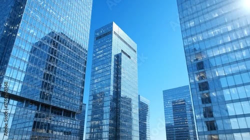 Wallpaper Mural Low-angle view of multiple gleaming, modern skyscrapers against a clear, brilliant blue sky Torontodigital.ca