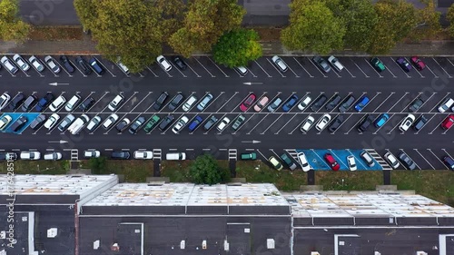 Aerial top down view of residential building and parking lot in the city