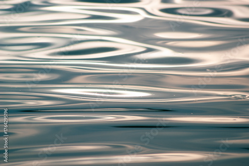 Obraz na plátně Abstract macro view of the rippling water surface reflecting bright sunlight