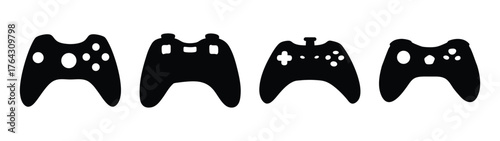 Four black game controllers displayed horizontally representing modern gaming input devices