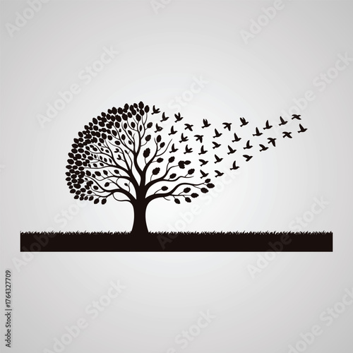 Black silhouette of a tree with leaves transforming into a flock of birds flying away against a light gray gradient background