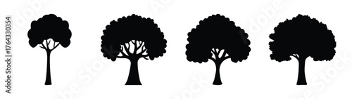 Four distinct black silhouette trees four unique natural woodland elements for graphic design