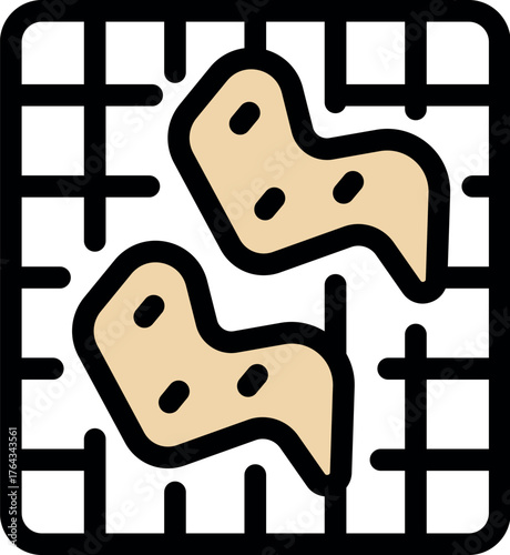 Thinly sliced ginger root pieces drying on a square grid, likely for later use in cooking or medicinal purposes