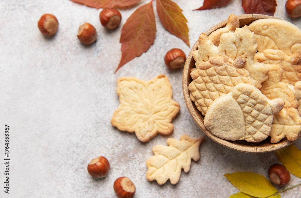 Fototapeta premium Autumn cookies with nuts and colorful leaves