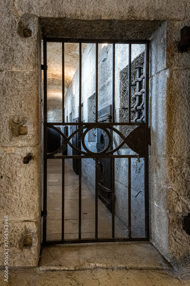 Obraz premium Iron-barred corridor leading from Doge Palace prison to New Prisons interior