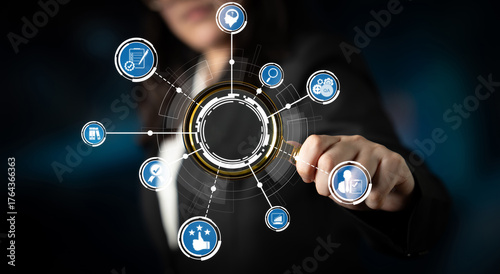 Quadro em tela A business professional interacts with digital technology icons, highlighting themes of innovation and connectivity, essential in today dynamic business landscape