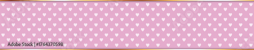 long pink colored ribbon banner with heart pattern and gold frame	