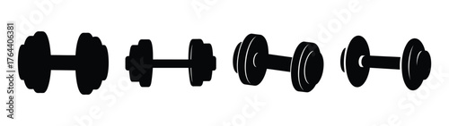Collection of four dumbbells various styles and sizes representing fitness and weightlifting exercises