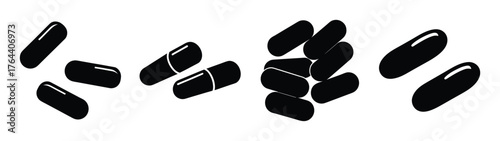 Collection of black capsules scattered and grouped pharmaceutical supplements for health and wellness