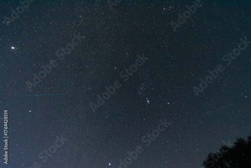 Clear starry night sky with Orion constellation and bright stars visible